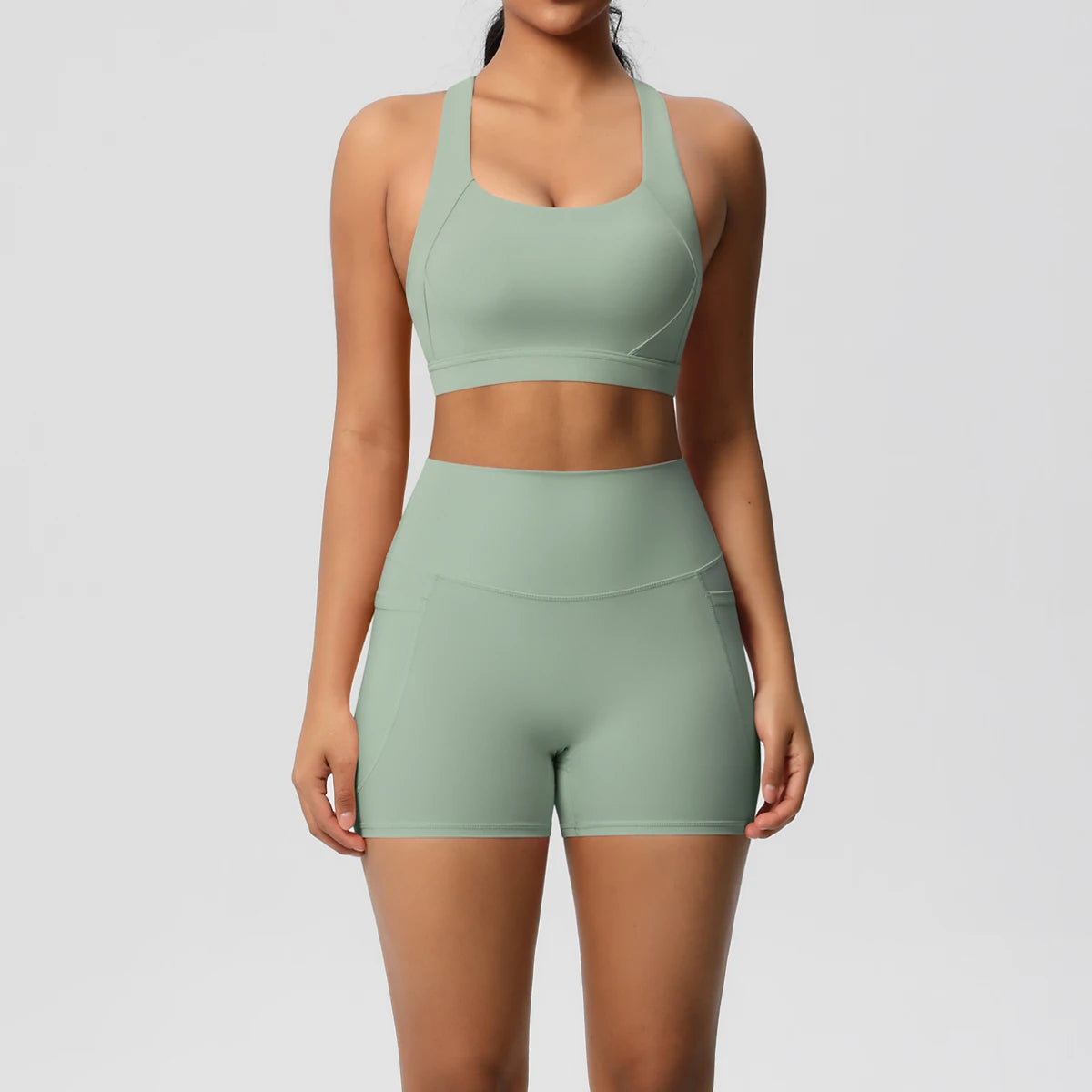 Pocketed Yoga Set – Sleeveless Top & Slim Ankle Leggings